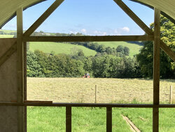 Enjoying the view and hay making in the field.