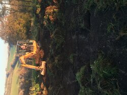 Beginning to excavate the remains of the POW Camp - very wet and muddy!